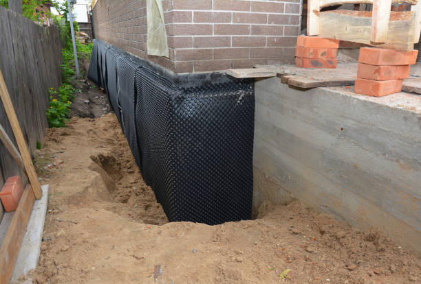 Happy homeowners after waterproofing job in Upper Marlboro
